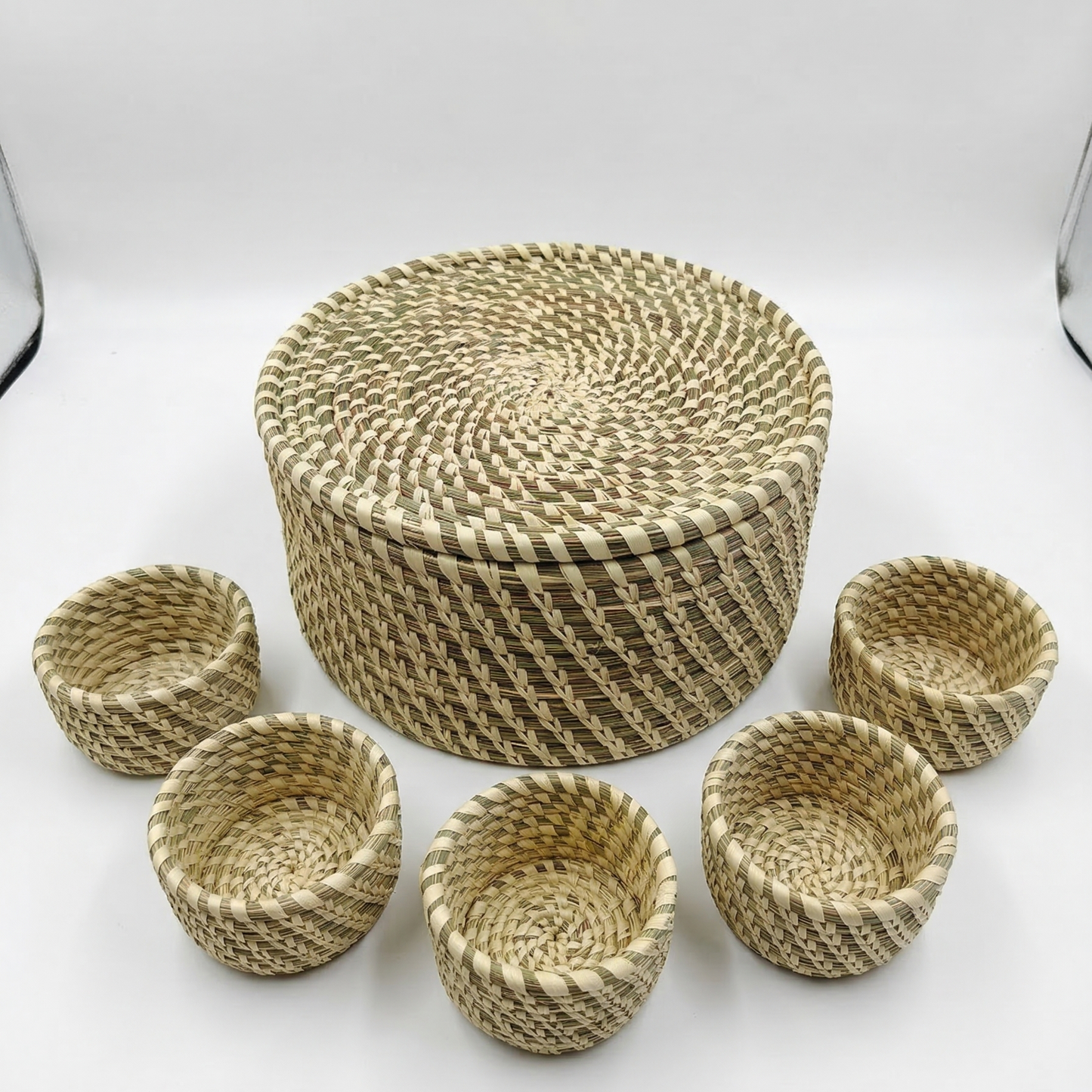 Handwoven natural Sabai grass lidded box with 5 small storage bowls inside, used as an eco-friendly masala dabba,jewelery and utility organizer.