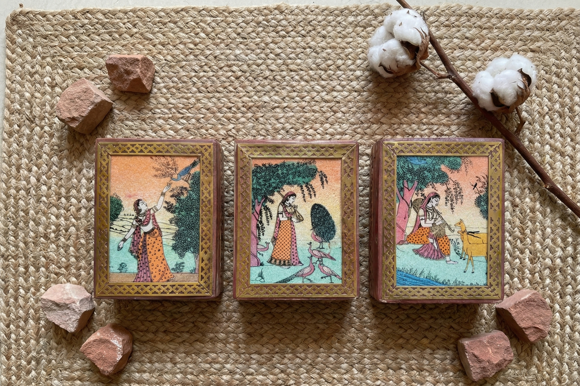 Small wooden jewelry box (assorted designs) framed with brass lattice work. Features colorful Indian miniature painting of royal figures and peacocks. Vintage style home decor.