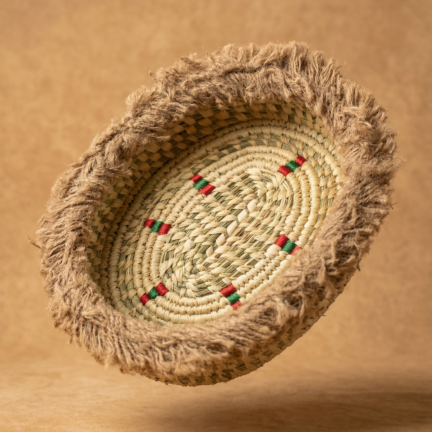 Handwoven basket with decorative elements on a brown background