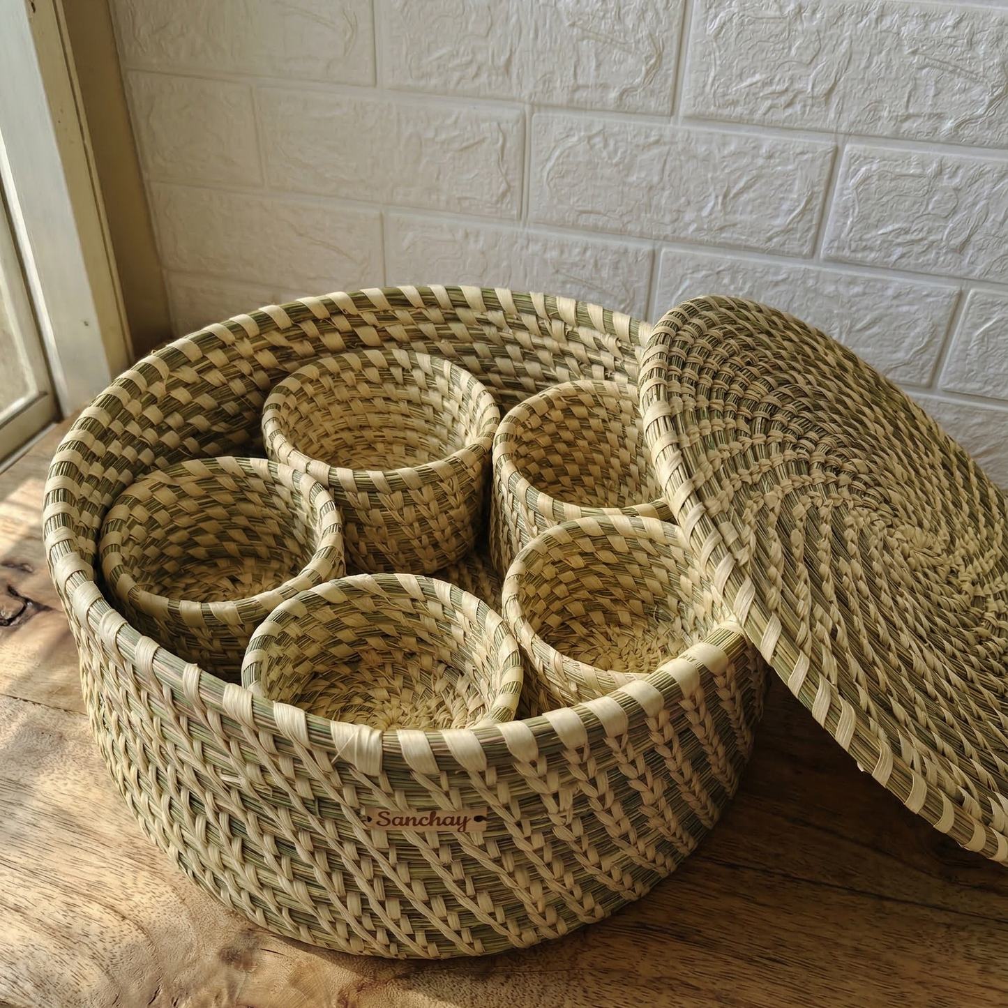 Handwoven natural Sabai grass lidded box with 5 small storage bowls inside, used as an eco-friendly masala dabba and utility organizer.