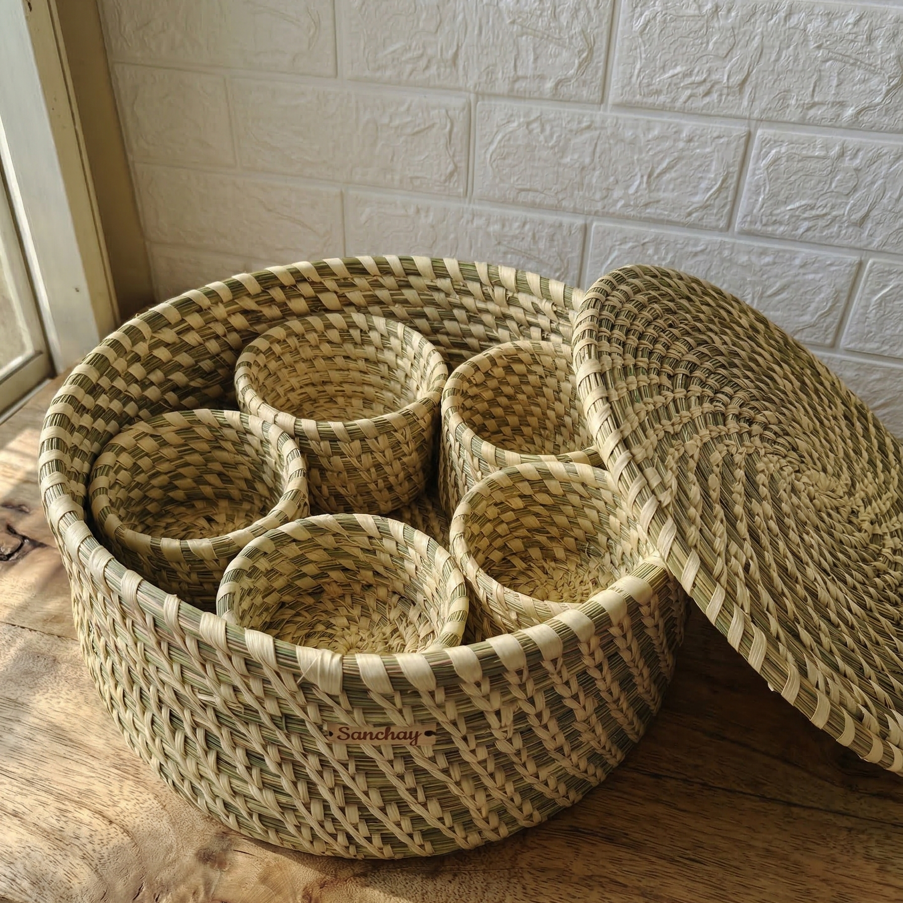 Handwoven natural Sabai grass lidded box with 5 small storage bowls inside, used as an eco-friendly masala dabba and utility organizer.