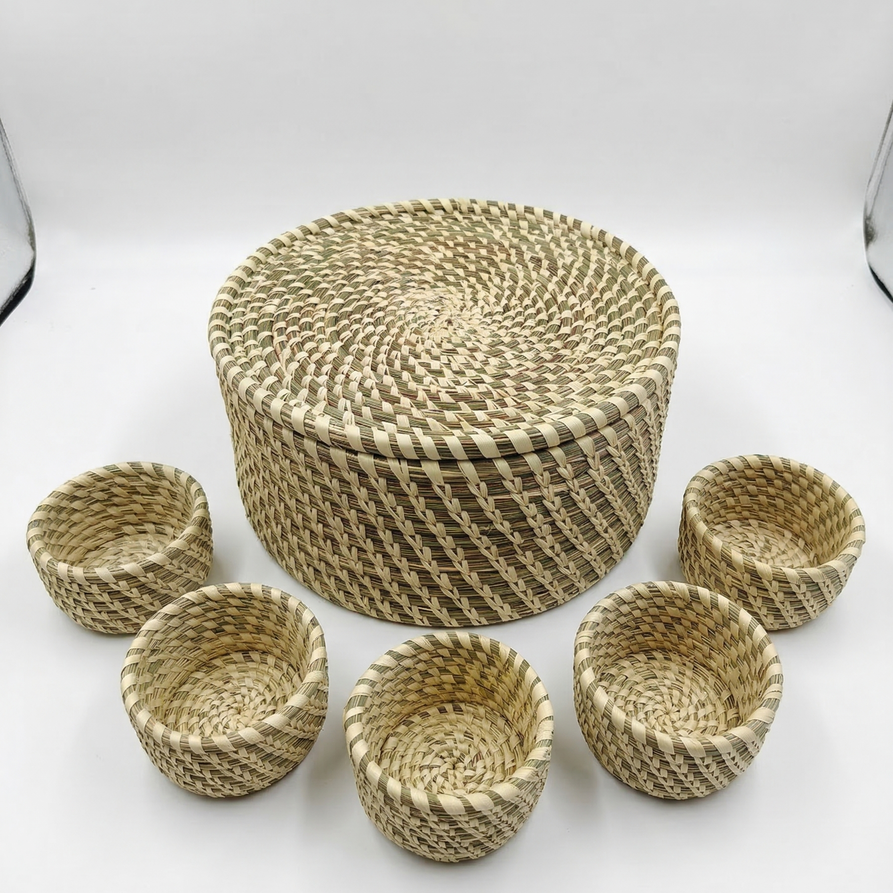 Handwoven natural Sabai grass lidded box with 5 small storage bowls inside, used as an eco-friendly masala dabba,jewelery and utility organizer.