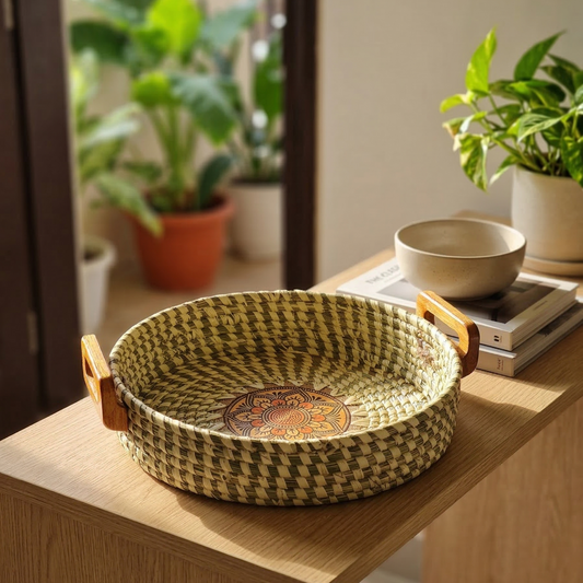 Handwoven natural Sabai grass serving tray with wooden handles and a decorative central mandala pattern.