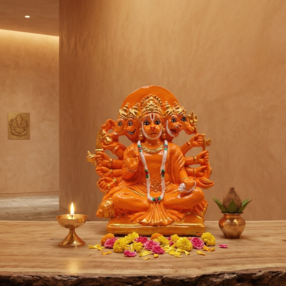 Vibrant orange Panchmukhi Hanumanji murti with five divine faces and ten arms, seated on a wooden platform with diya and kalash