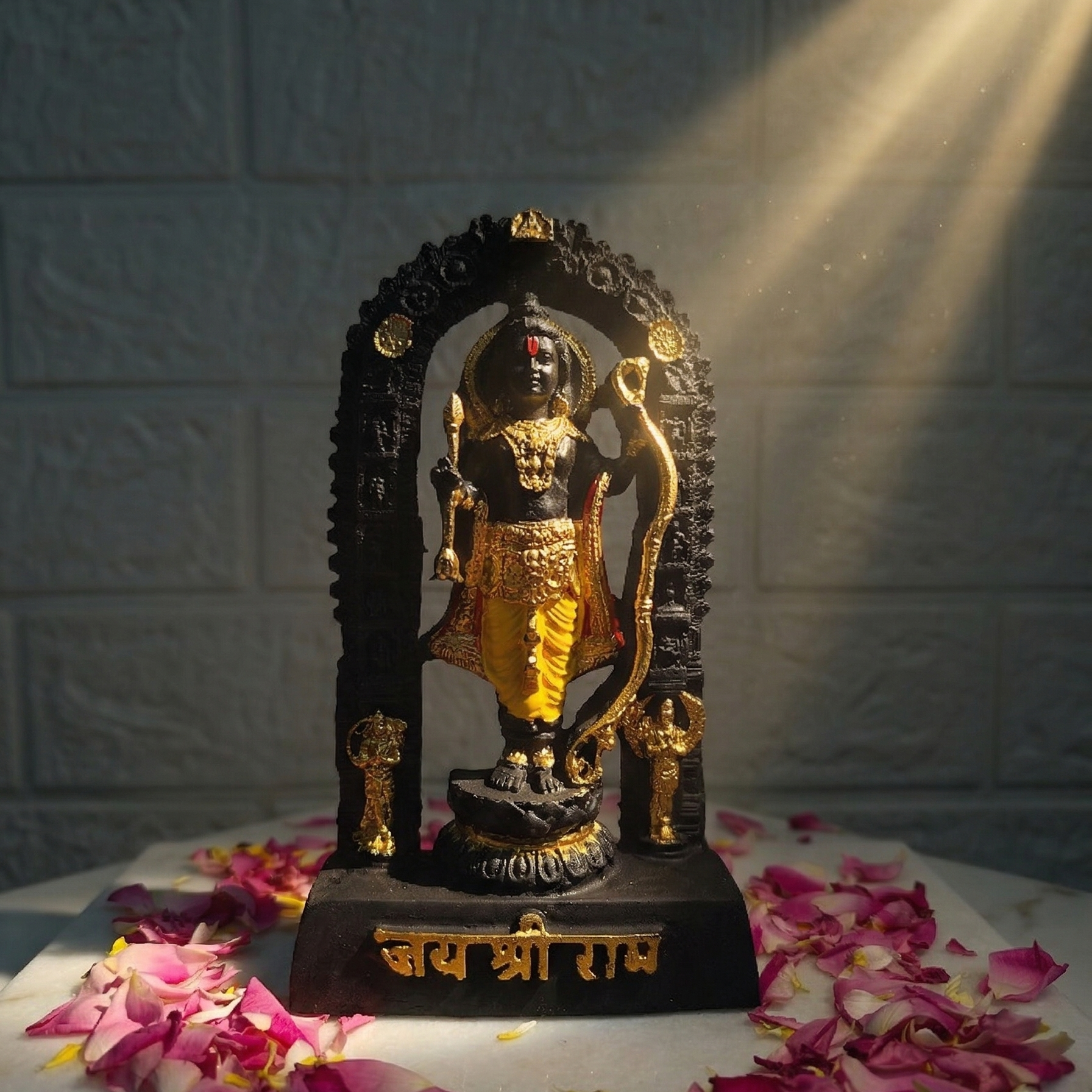 Sacred black Shri Ram Lalla murti standing inside an archway, richly adorned with golden jewelry and garments, with Jai Shri Ram inscribed on the base illuminated by sunlight