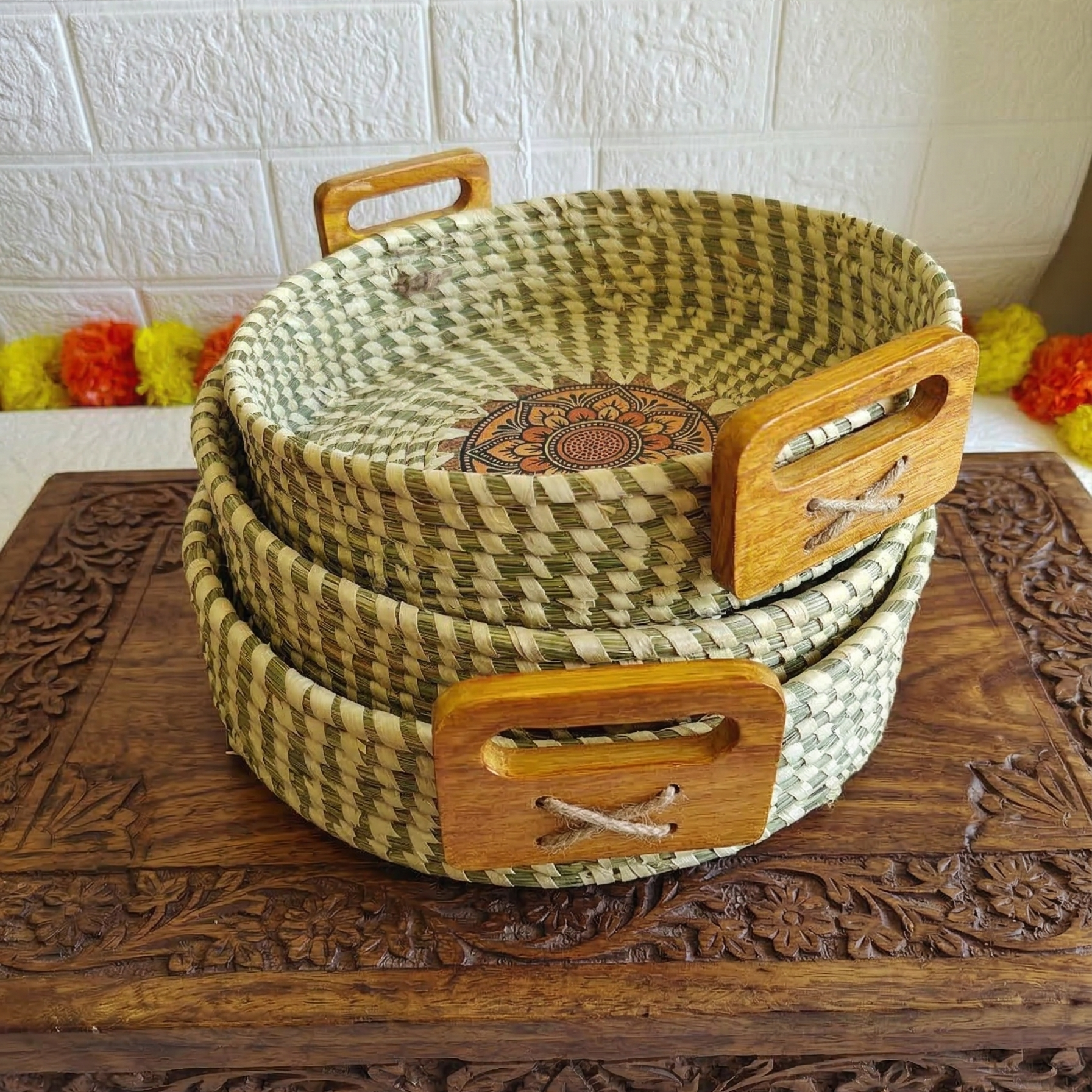 Handwoven natural Sabai grass serving tray set with wooden handles and a decorative central mandala pattern.