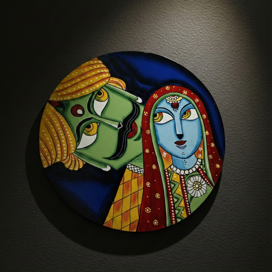 Round, hand-painted wooden wall plate featuring vibrant Rajasthani Kathputli puppet art of a man and woman, hanging on a dark wall as cultural decor.