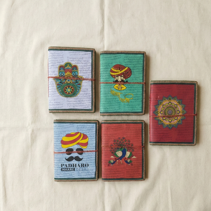 Assorted handmade cotton paper notebooks with Indian art designs like mandala and peacock - Customer receives one random design.