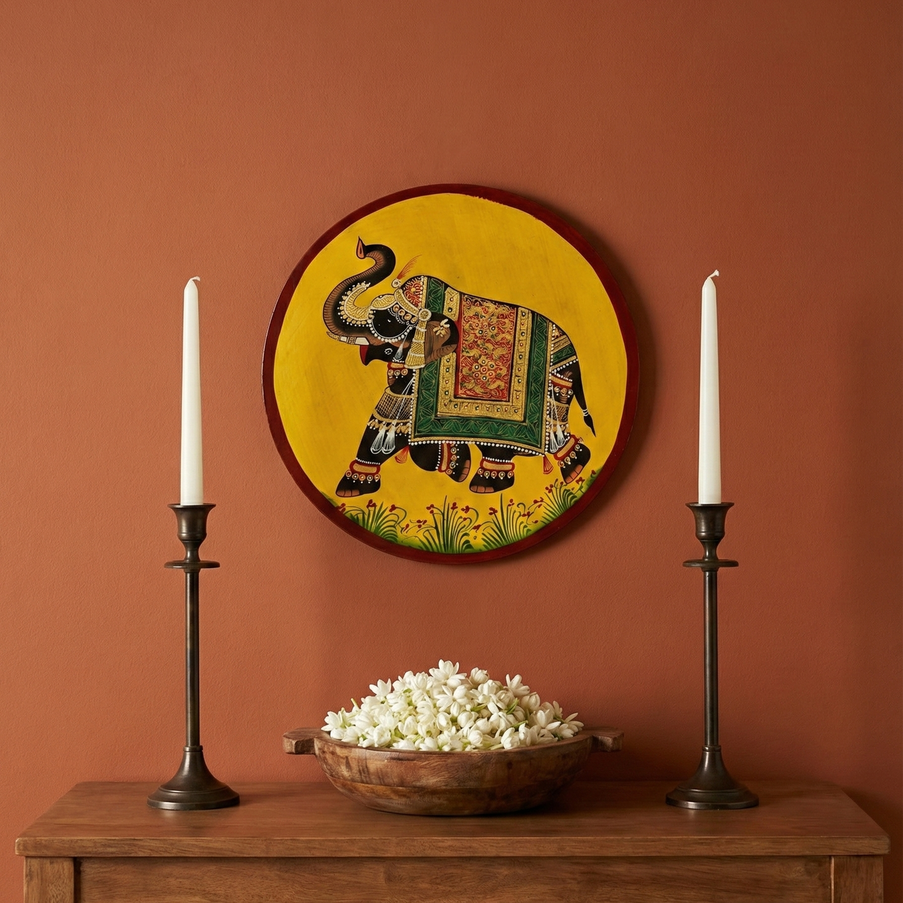 Pichwai Hand-Painted Elephant Wall Plate styled with candles and flowers for traditional Indian home decor.